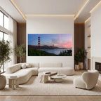 Unexpected Grace panoramic Golden Gate Bridge artwork displayed above a curved cream sofa in an elegant contemporary living room.