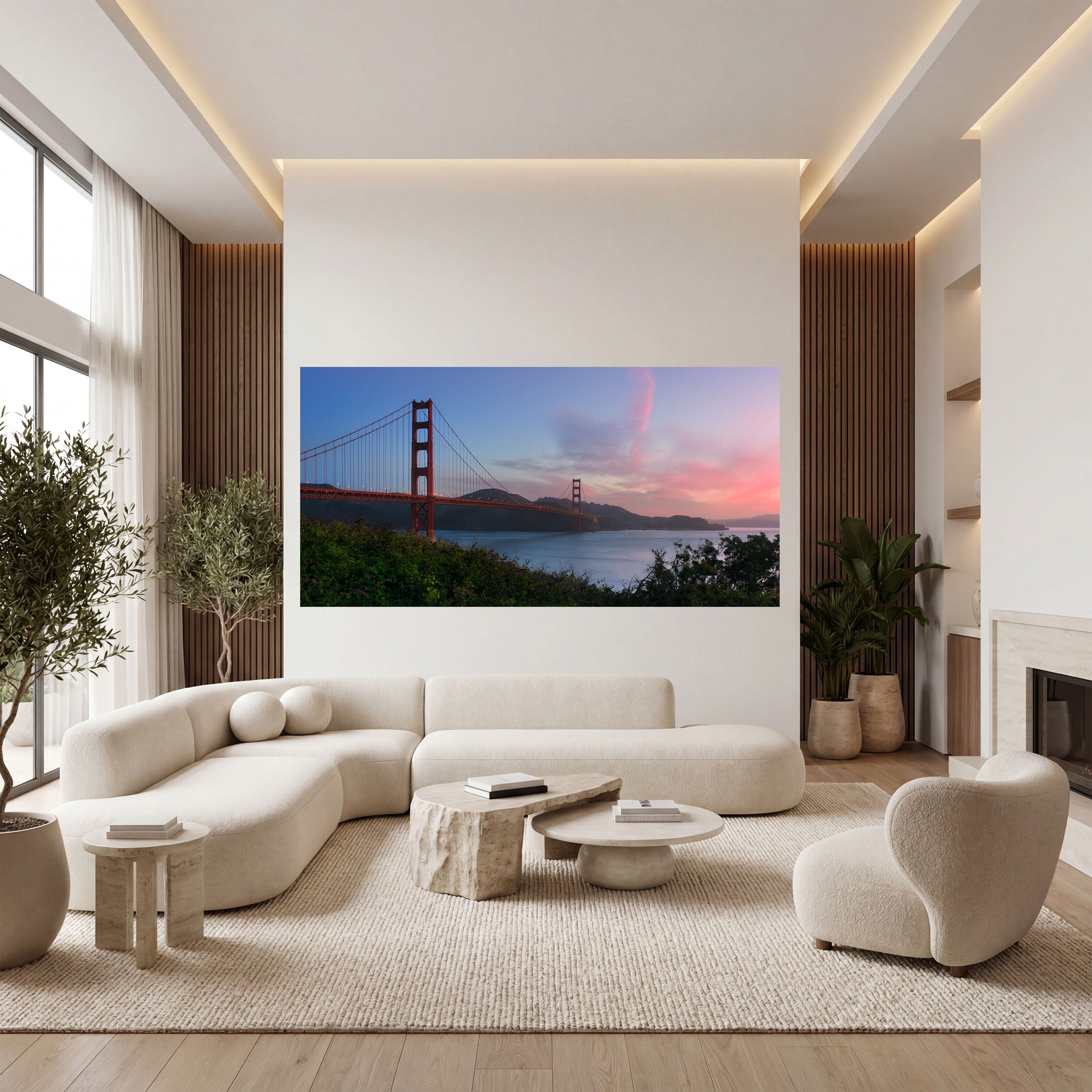 Unexpected Grace panoramic Golden Gate Bridge artwork displayed above a curved cream sofa in an elegant contemporary living room.