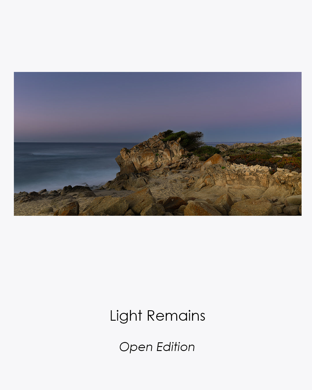 Light Remains fine art photograph of a rocky coastline illuminated by soft lavender blue-hour light.