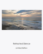 Refracted Silence limited-edition aerial photograph of surfers and reflected sunset light at Ocean Beach, San Francisco.