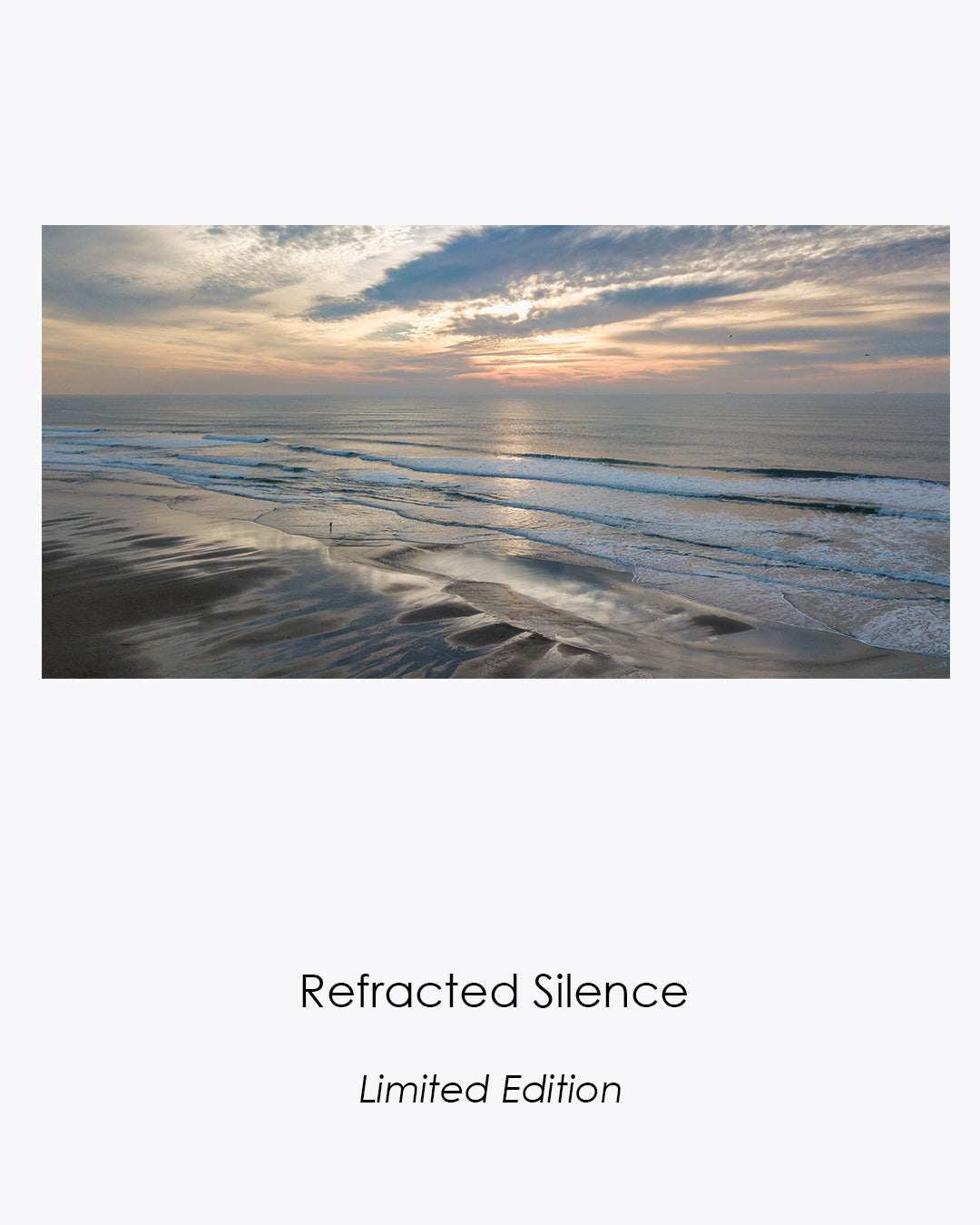 Refracted Silence limited-edition aerial photograph of surfers and reflected sunset light at Ocean Beach, San Francisco.