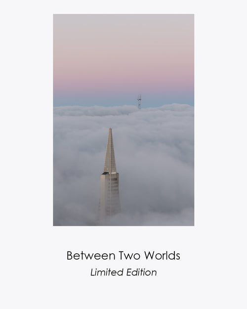 Between Two Worlds, a vertical fine art photograph of San Francisco landmarks rising above a sea of fog at dawn.
