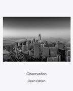 Observation, a black-and-white aerial view of San Francisco skyscrapers rising above the fog.