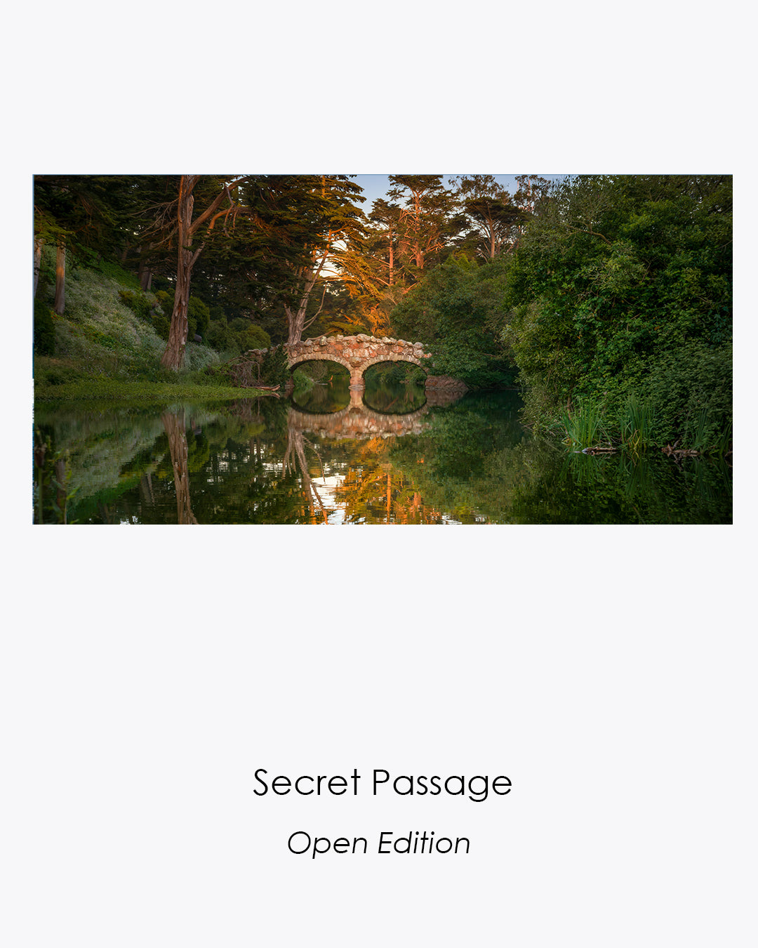 Secret Passage fine art photograph of a hidden stone bridge, warm light, and tranquil reflections in Golden Gate Park.
