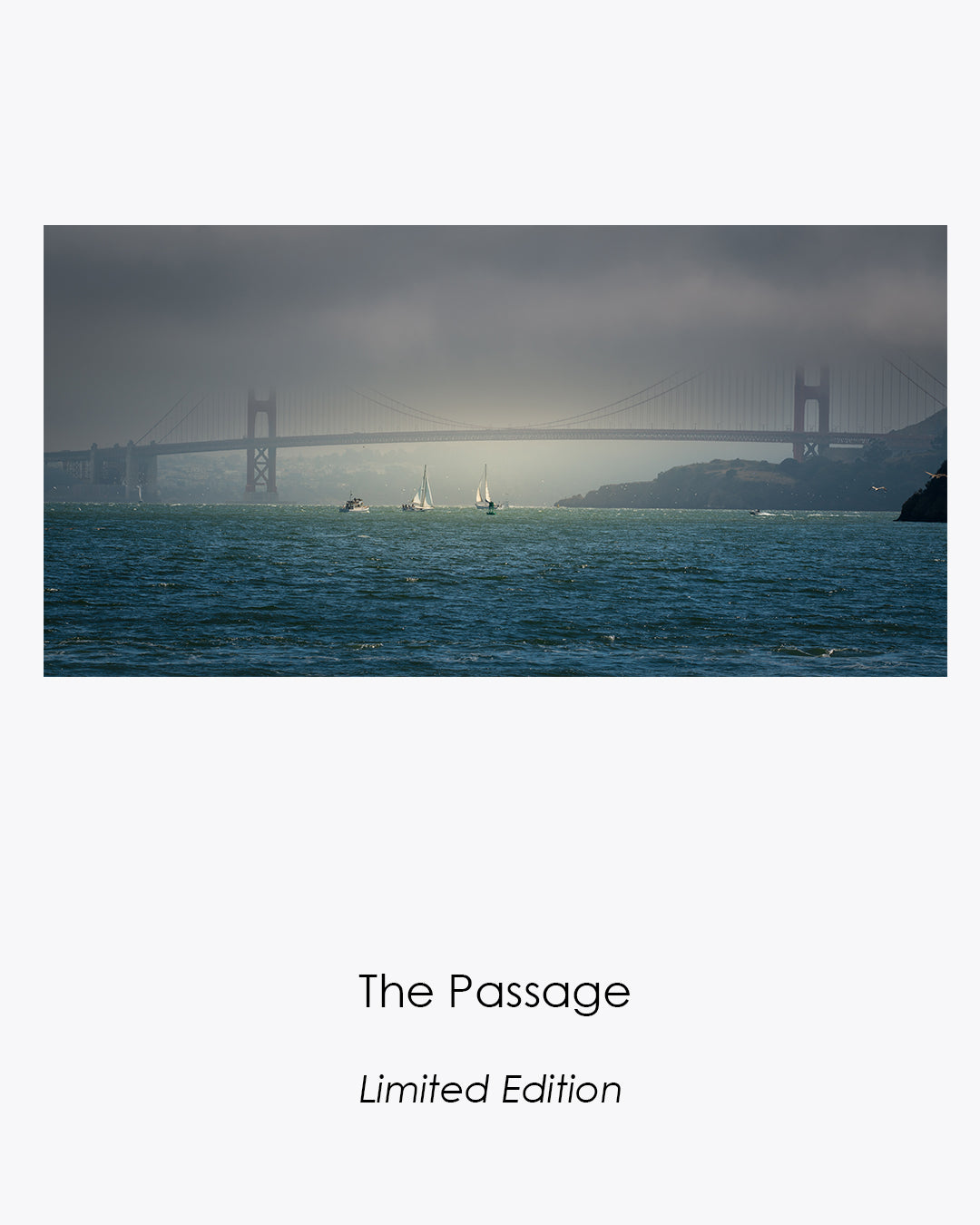 The Passage limited-edition fine art photograph featuring sailboats illuminated beneath the fog-covered Golden Gate Bridge.