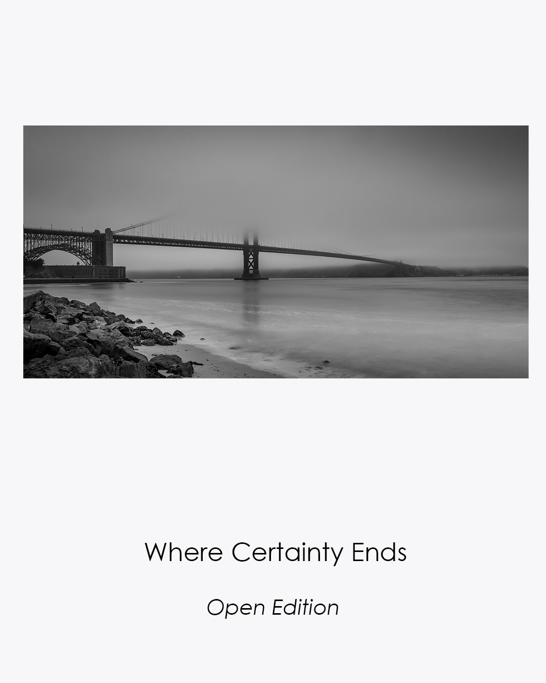 Golden Gate Bridge disappearing into morning fog in the black-and-white photograph Where Certainty Ends.