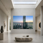 Large-scale Beyond Measure Chicago aerial photograph displayed on a monumental wall in a contemporary gallery beneath a skylight.