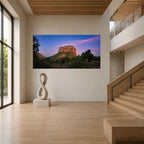 Large panoramic acrylic print of Evening Unfolding displayed on a two-story gallery wall beside a sculptural staircase in a contemporary interior.