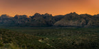 The final warm light of sunset illuminating the mountains and desert landscape of Red Rock Canyon, Nevada.