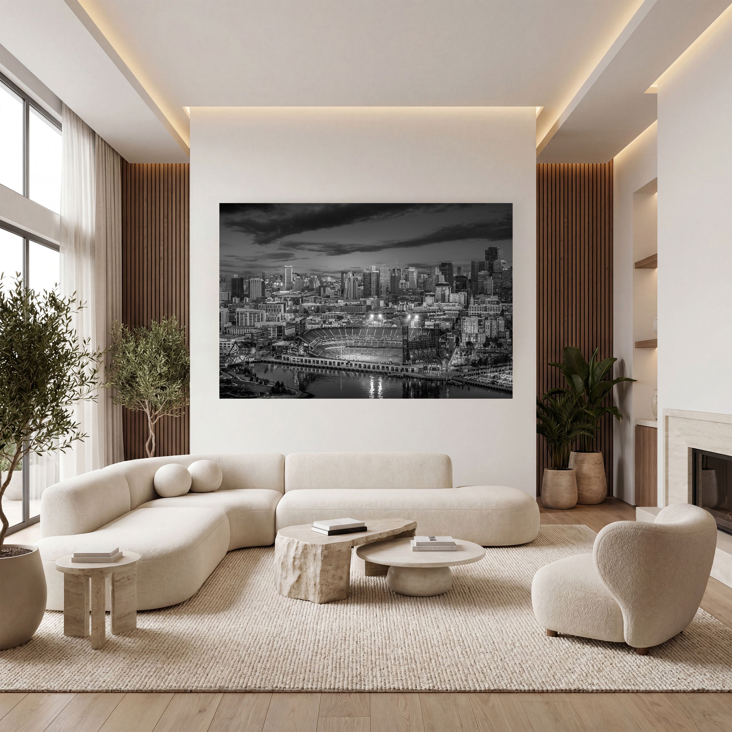 Nocturne: Oracle Park displayed as large-format black-and-white wall art above a cream sectional in a modern living room.