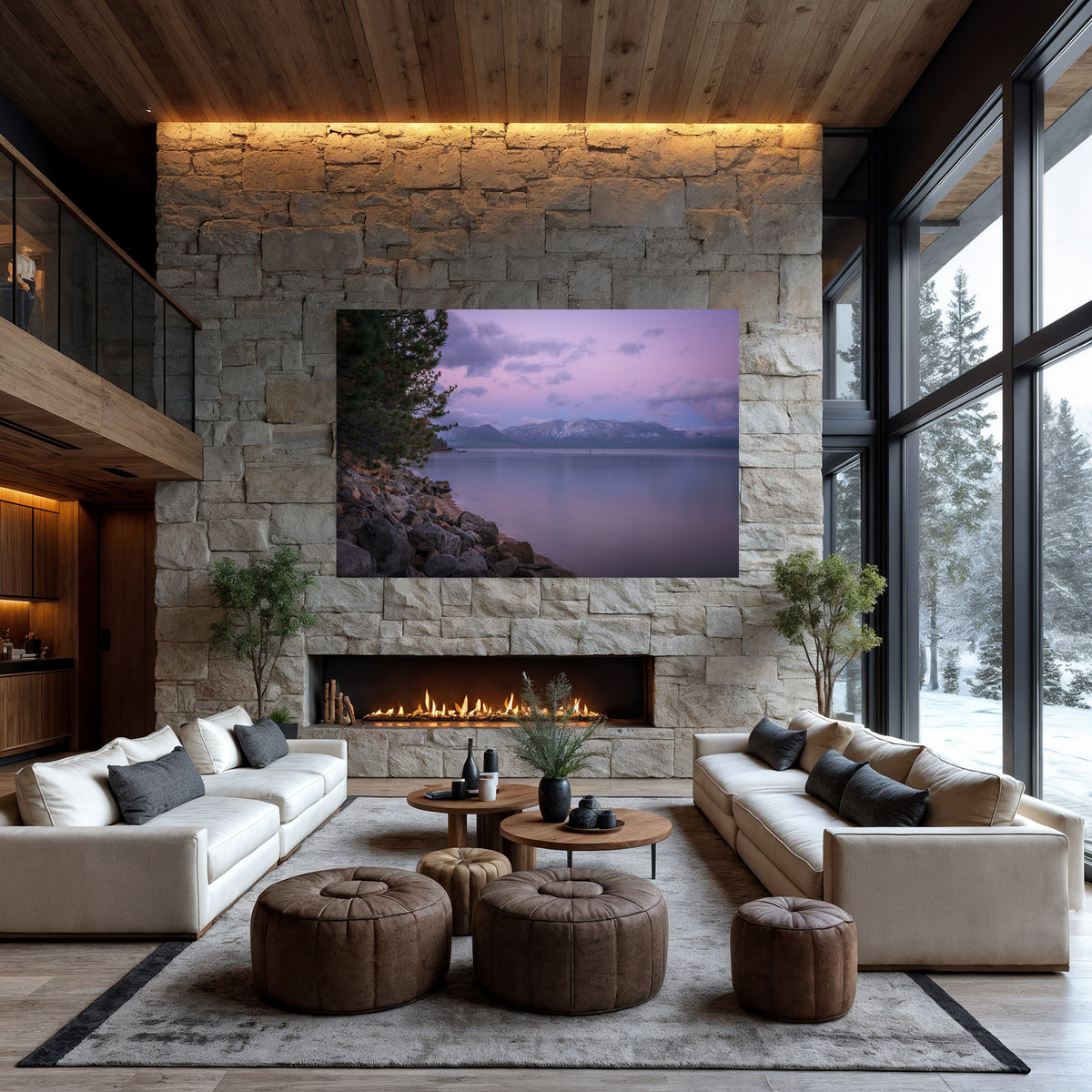 After the Snow displayed above a stone fireplace in a modern living room, with snowy trees visible through tall windows.