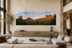 Large panoramic Sedona landscape artwork displayed above a long wood console in an elegant, neutral-toned contemporary interior.