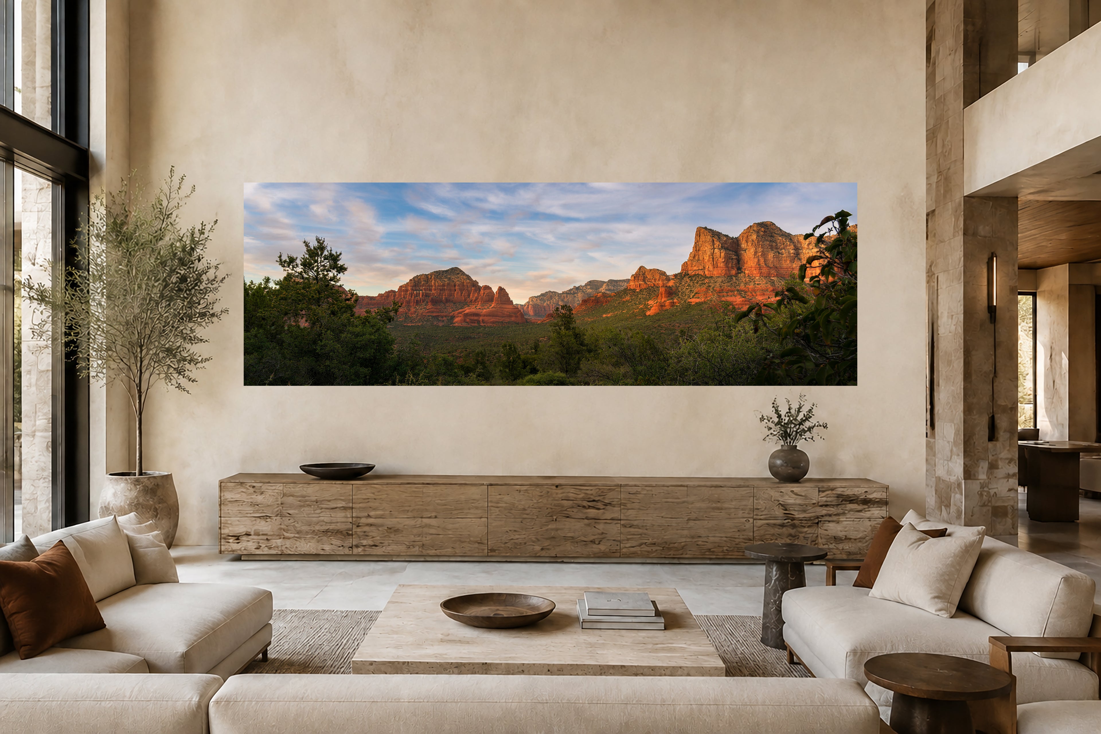 Large panoramic Sedona landscape artwork displayed above a long wood console in an elegant, neutral-toned contemporary interior.